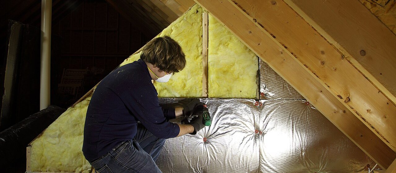 Worker inspecting an attic