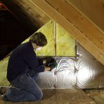 Worker inspecting an attic